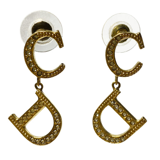 Christian Dior CD gold-tone metal ogo earrings embellished with white inset crystals and Dior logo stamp in back. Clutch back closure. 