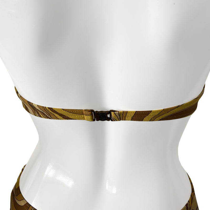 Celine psychedelic swimsuit with all over retro swirl design top and mid rise bottoms with a feature bronze-tone rectangular logo engraved plate that attaches the top to the bottom. Non adjustable halter style top with clip back logo closure, fully lined. Color: gold, brown, tan. Made in France 