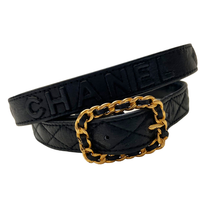Chanel quilted lamb leather logo gold chain buckle belt by Karl Lagerfeld for Chanel, Autumn 1992. Diamond quilting with CHANEL letters embossing on belt leather and intertwined leather through gold-tone chain buckle closure. Adjustable sizing with 3 hole adjustment. Made in France