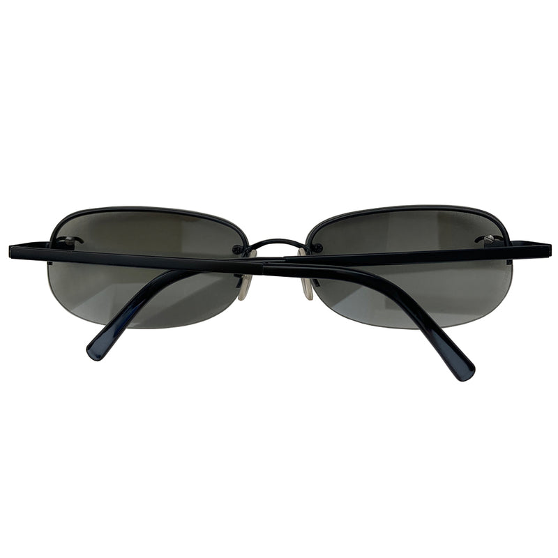 Chanel Black CC logo rectangle shape sunglasses with flat black metal frame along upper and frameless on the bottom with charcoal tinted lenses, black CC logo at each lens, Chanel engraved nose pad. Style: 4099 c.101/11 Made in Italy.