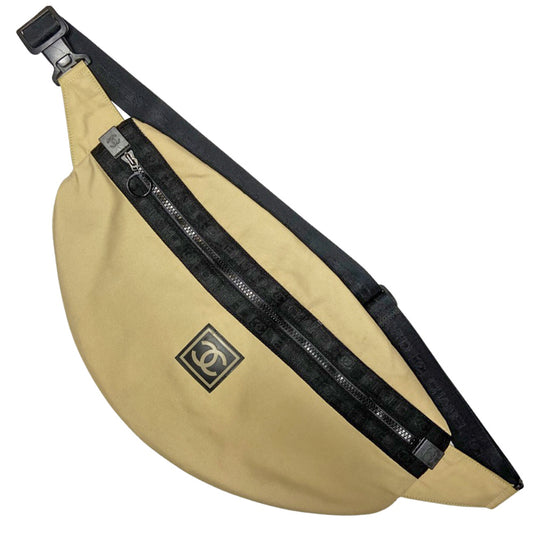 Chanel XL Sport Line cream color canvas waist pouch by Karl Lagerfeld for Chanel, 2002-2003 with black adjustable belt strap, clip, zipper and logo satin webbing accent.  Rubber CC box front logo, CC logo at zipper ends. Chanel logo black jacquard textile lining with one interior zip pocket. Made in Italy 