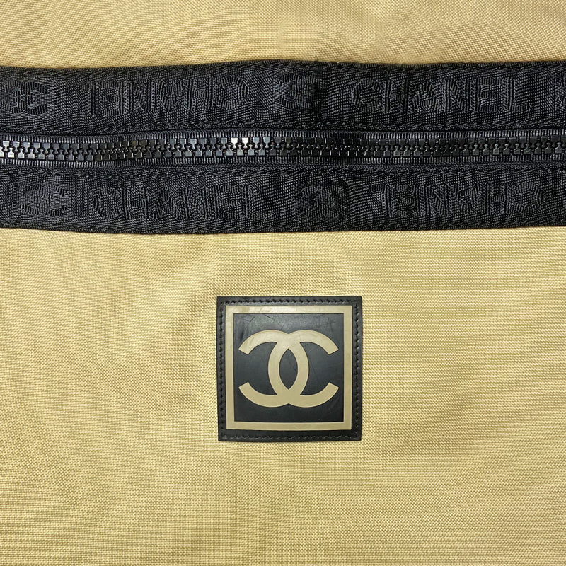 Chanel XL Sport Line cream color canvas waist pouch by Karl Lagerfeld for Chanel, 2002-2003 with black adjustable belt strap, clip, zipper and logo satin webbing accent.  Rubber CC box front logo, CC logo at zipper ends. Chanel logo black jacquard textile lining with one interior zip pocket. Made in Italy 
