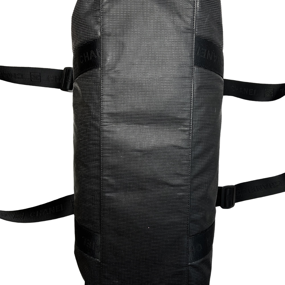 Chanel Sport bi-color grey canvas and black textured rubber canvas duffle/travel bag by Karl Lagerfeld for Chanel 2003/2004 with double zip closure, boxed rubber CC front logo. Double Chanel embossed adjustable satin webbing logo carry straps, logo padlock style black rubber zipper pulls, black nylon lining with single zip pocket. Made in Italy