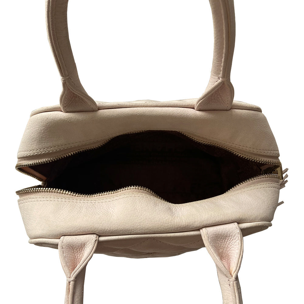 Chanel powder pink Mini Tassel Boston bag by Karl Lagerfeld for Chanel 2004. Rectangle suede quilted bowler bag with CC front logo and 2 rolled top handles, gold-tone feet on bottom. Top zipper closure with gold logo cube and tassel zipper pull, pink Chanel print lining, zip pocket. Outer rear slip pocket. Made in France 