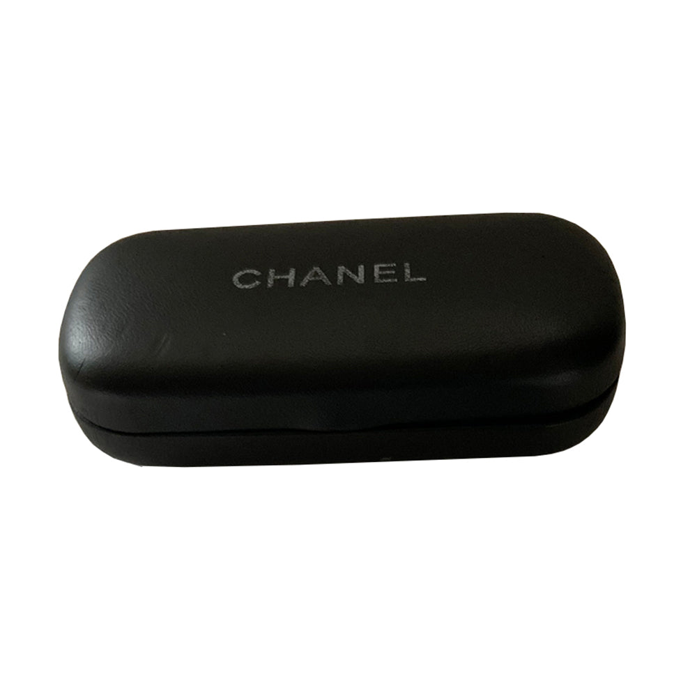 Chanel gold-tone metal frame and thick quilted acetate arms sunglasses by Karl Lagerfeld for Chanel, Infinity shaped design metal frame over shield lens, CHANEL printed on lens at nose bridge with booze lens Style: 4097 Made in Italy