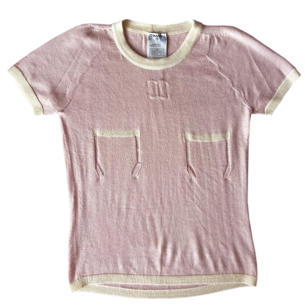 Chanel short sleeve pastel pink cashmere sweater Karl Lagerfeld for Chanel, 2004 with white accent and trim Interlocking CC logo at center chest and 2 front “faux” pockets. Size: FR 38 Made in Italy 