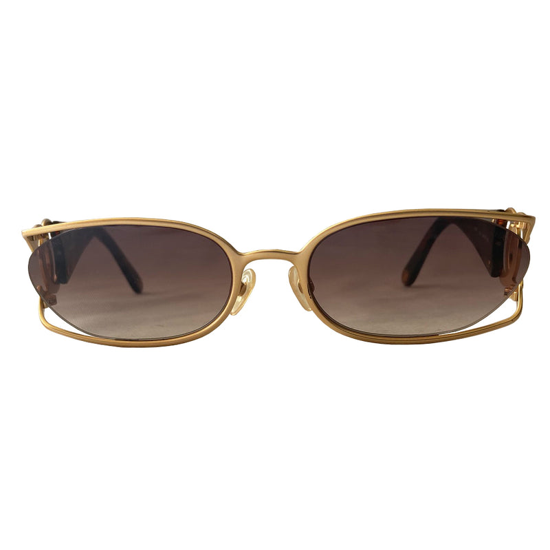 Chanel floating lens logo sunglasses by Karl Lagerfeld for Chanel with brushed gold-tone metal frame with cutout side CC logo at temples and floating brown tinted oval lenses, thick tortoise acetate arms. CHANEL printed on lens. Style: 4023 Made in Italy 
