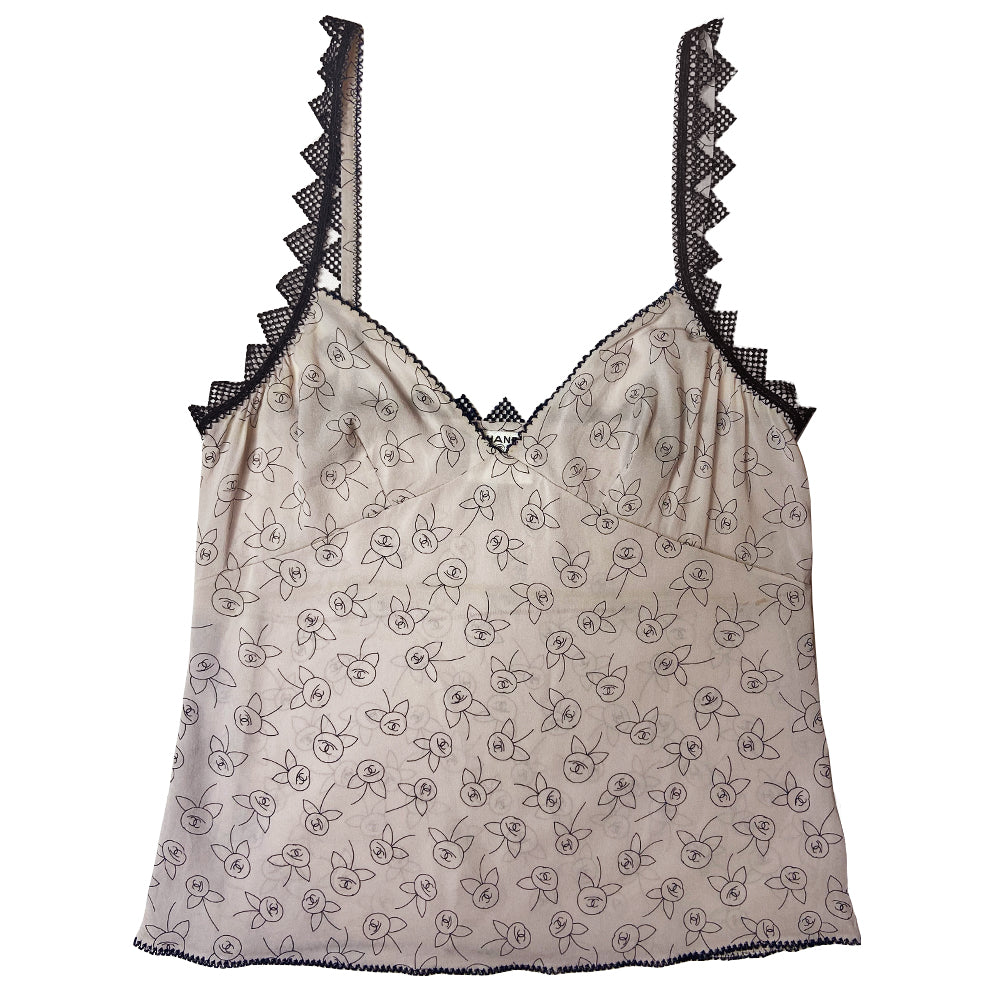 Chanel camellia blossom print soft silk camisole by Karl Lagerfeld for Chanel, Fall 2003 featuring all over camellia blossoms with CC logo centers. Triangle shaped black lace trim on straps and along back with decorative embroidered décolletage and bottom hemline. Made in Italy 