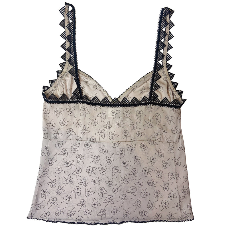 Chanel camellia blossom print soft silk camisole by Karl Lagerfeld for Chanel, Fall 2003 featuring all over camellia blossoms with CC logo centers. Triangle shaped black lace trim on straps and along back with decorative embroidered décolletage and bottom hemline. Made in Italy 