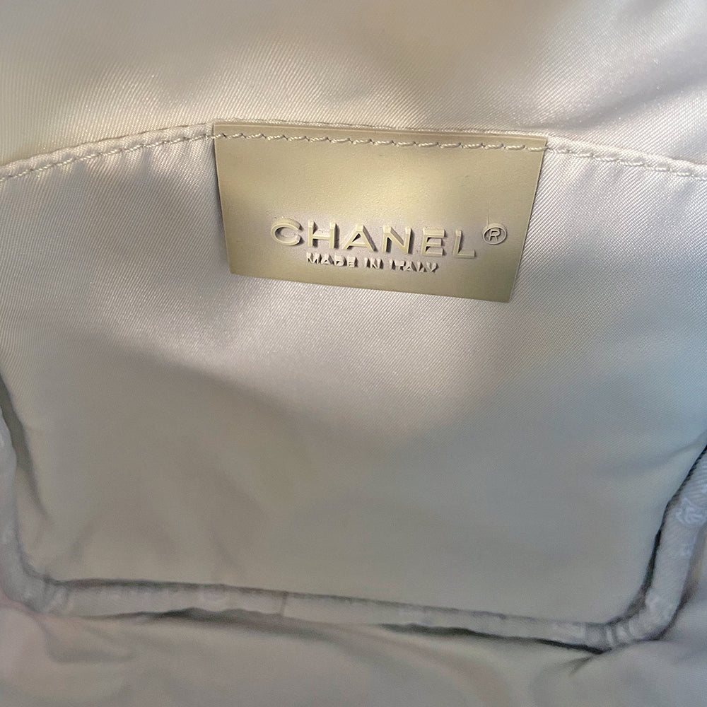 Chanel grey with silver Sport Line nylon canvas rectangular cross body messenger bag by Karl Lagerfeld for Chanel, 2001 with angled box front CC logo, rubber CHANEL side logos, grey piping and long sating webbing logo removable shoulder strap. Top ziper with grey textile interior and inside slip pocket. Made in Italy 