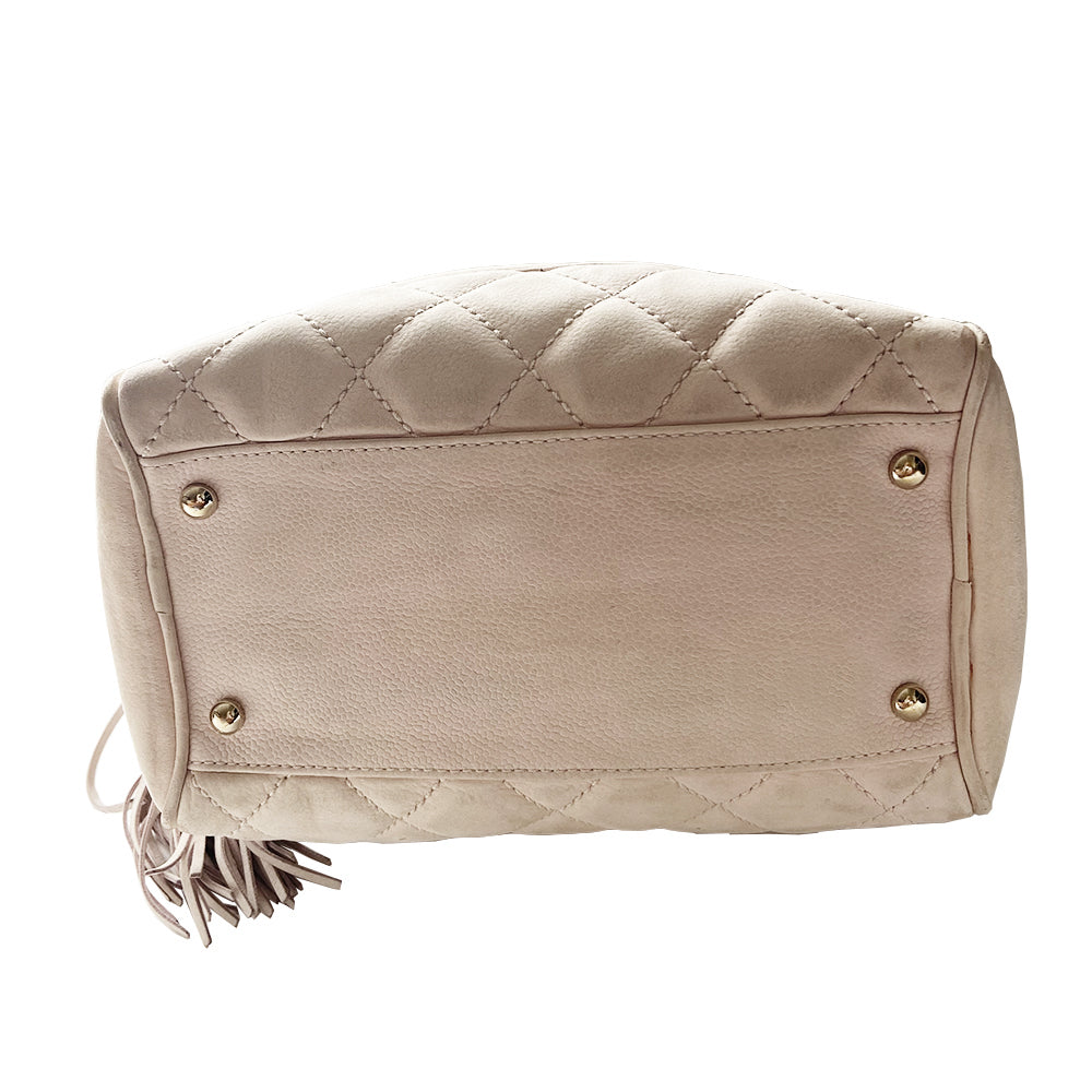Chanel powder pink Mini Tassel Boston bag by Karl Lagerfeld for Chanel 2004. Rectangle suede quilted bowler bag with CC front logo and 2 rolled top handles, gold-tone feet on bottom. Top zipper closure with gold logo cube and tassel zipper pull, pink Chanel print lining, zip pocket. Outer rear slip pocket. Made in France 