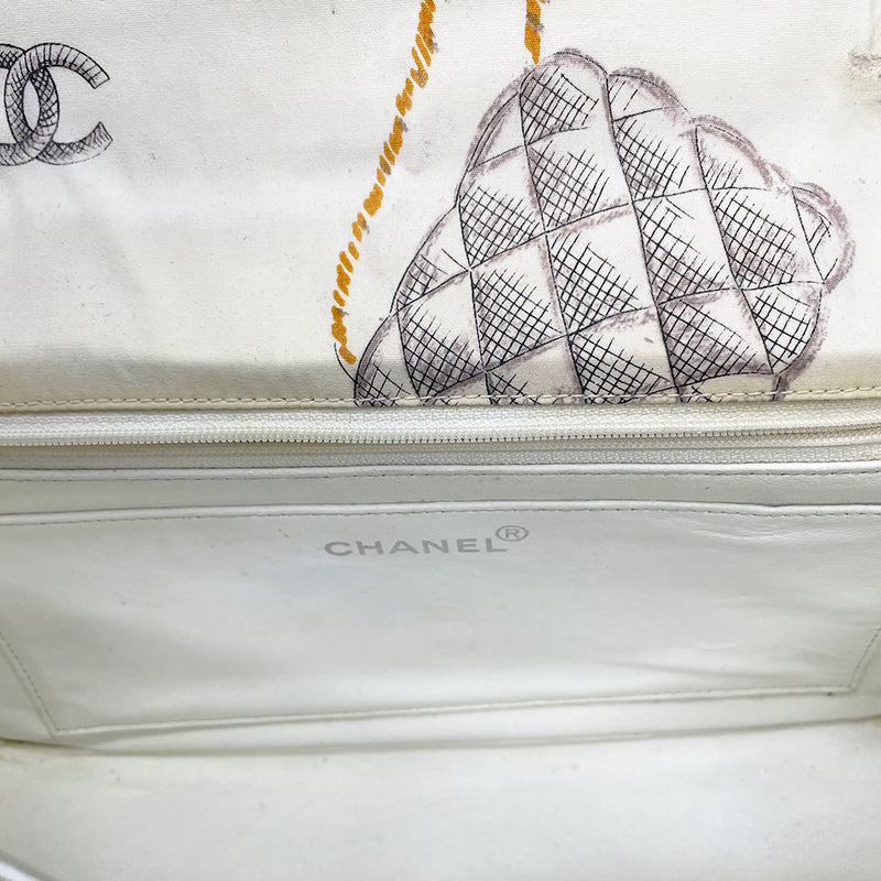 Karl Lagerfeld for Chanel 1996 printed quilt fabric flap bag with flower blossoms, pearl strands, CC logos, Chanel shoe, silver-tone CC turnlock closure, rear slip pocket, double intertwined chain and fabric chain strap, white leather lining. Interior zip pocket, 1 slip pocket, Date code tag attached. Made in France 