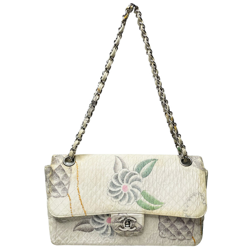Karl Lagerfeld for Chanel 1996 printed quilt fabric flap bag with flower blossoms, pearl strands, CC logos, Chanel shoe, silver-tone CC turnlock closure, rear slip pocket, double intertwined chain and fabric chain strap, white leather lining. Interior zip pocket, 1 slip pocket, Date code tag attached. Made in France 