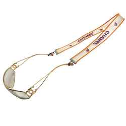 Chanel rubber sunglasses chain Karl Lagerfeld for Chanel, Autumn 2001 with translucent clear band with orange edges and burgundy printed out CHANEL logos and clovers. Adjustable rubber closures with silver-tone beaded slider. Made in France