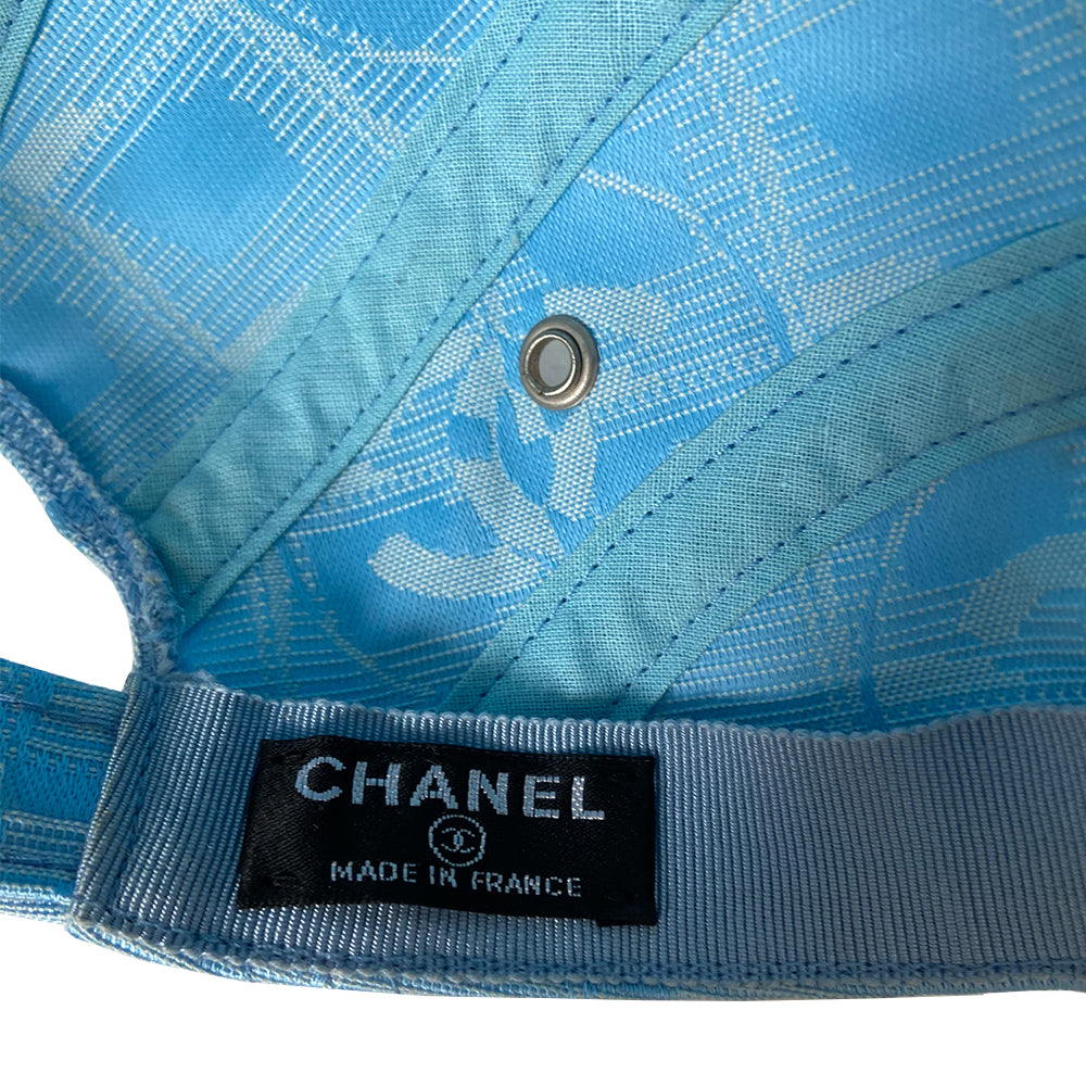 Chanel Travel Line pastel blue baseball hat by Karl Lagerfeld for Chanel, circa 2002. CC logo adjustable strap 4 panel ball cap with grosgrain inner band, silver-tone buckle and side grommets. Chanel engraved rear buckle. Size: M Made in France 