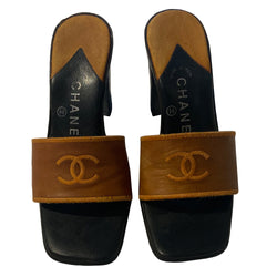 Chanel CC Logo tobacco color leather slip-on open toe heeled mules with embroidered interlocking CC logo on upper. Made in Italy