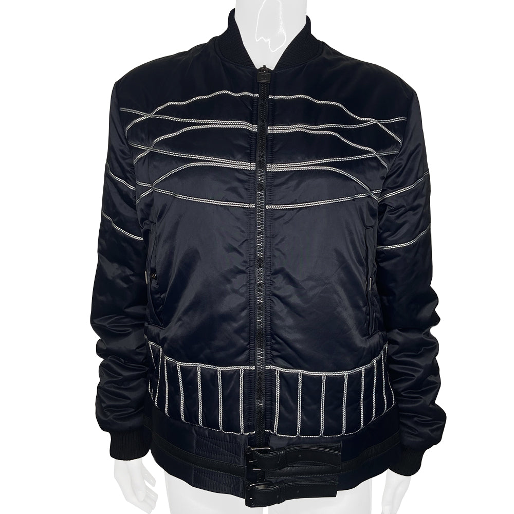 Chanel CC logo long sleeve black satin zip jacket by Karl Lagerfeld for Chanel, AW 2006 with side pockets, rib knit collar and cuffs, lamb leather accent, front zip, 2 buckle closure. CC engraved padlock zipper pull. White appliqué cording accents on front, back and sleeve with embroidered CC box logo, CHANEL in back, metal D-ring. Made in Italy 