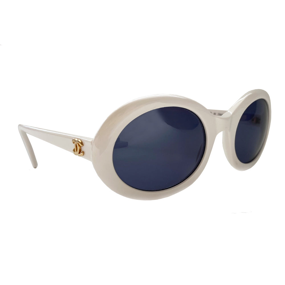 Chanel white acetate oval frame sunglasses by Karl Lagerfeld for Chanel circa 1992  with charcoal lenses and interlocking gold-tone CC logo at each arm. Style: 0016 00 Made in Italy 