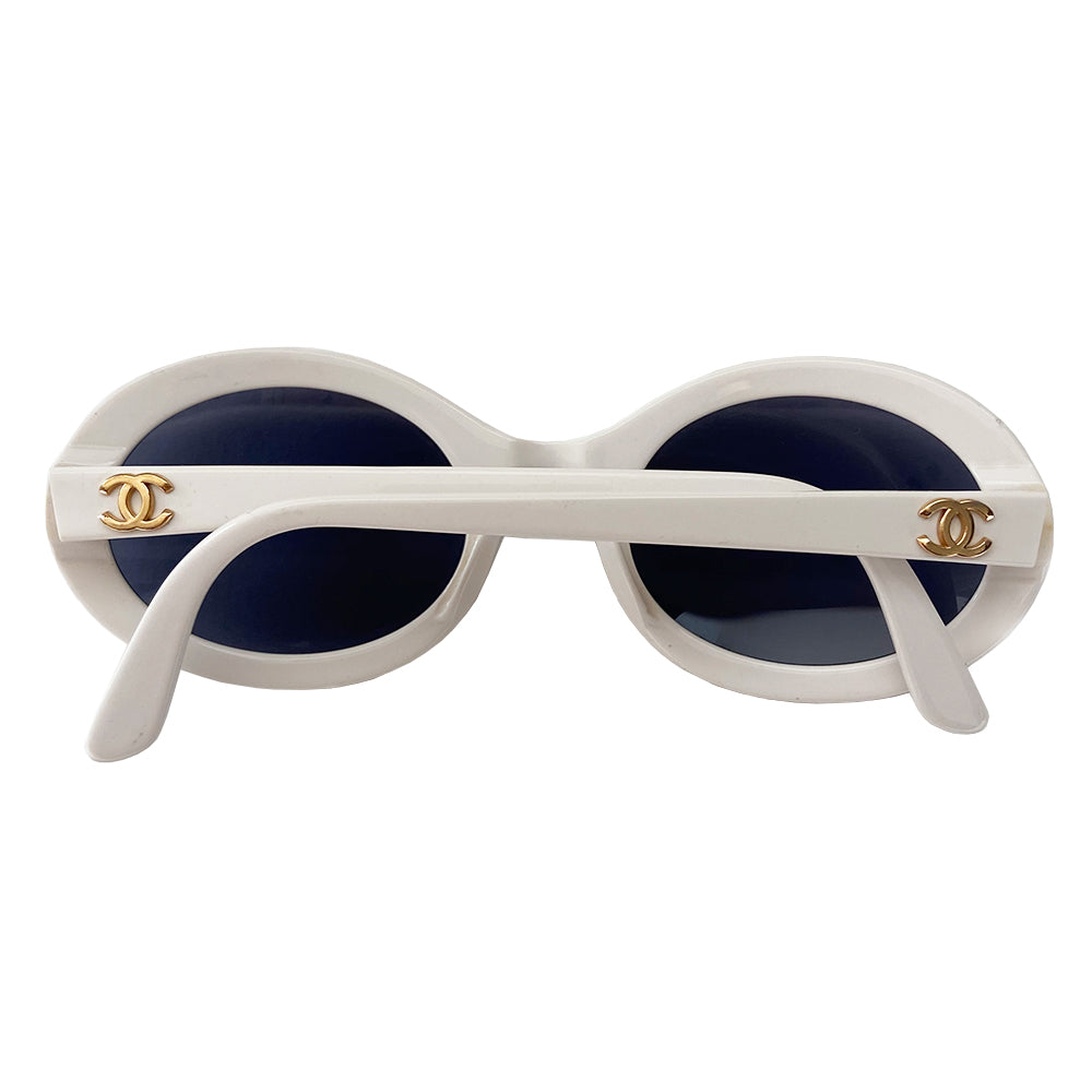 Chanel white acetate oval frame sunglasses by Karl Lagerfeld for Chanel circa 1992  with charcoal lenses and interlocking gold-tone CC logo at each arm. Style: 0016 00 Made in Italy 