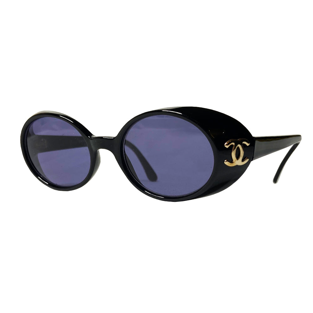 Chanel oval black acetate frame goggle style sunglasses by Karl Lagerfeld for Chanel 1990’s with interlocking CC gold logos at temple. Dark grey lenses.  Style: 05976 Case included. Made in Italy