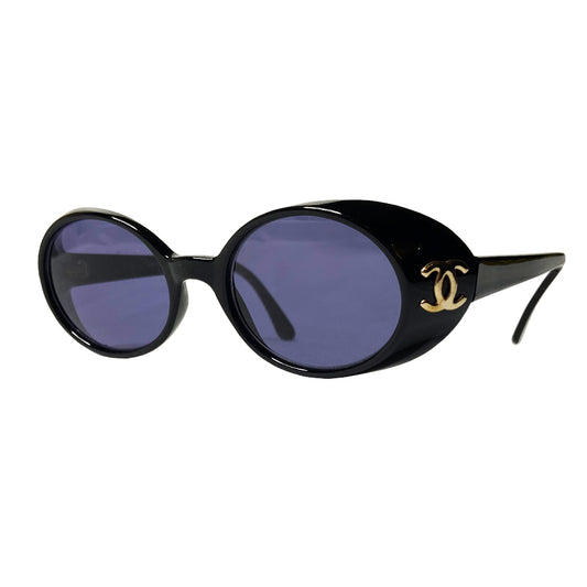 Chanel oval black acetate frame goggle style sunglasses by Karl Lagerfeld for Chanel 1990’s with interlocking CC gold logos at temple. Dark grey lenses.  Style: 05976 Case included. Made in Italy