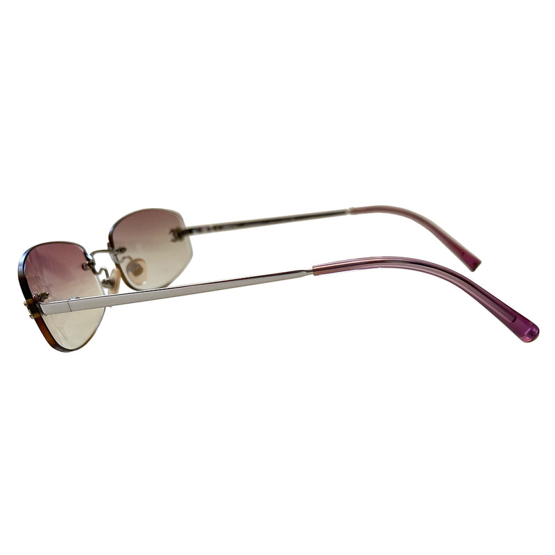 Chanel gradient lens rimless CC Logo sunglasses rounded rectangular shaped gradient pink rimless lenses with silver-tone CC logo on each lens. Silver-tone arms with purple ear piece Style: 4002 c124/58 Case included. Made in Italy. 