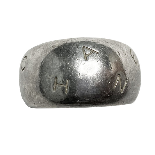Chanel alphabet ring by Karl Lagerfeld for Chanel, spring 1997. Silver-tone thick band ring with Chanel floating engraved letters. Size: approx 6.5 