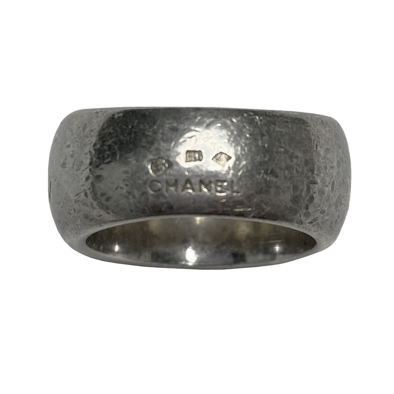 Chanel alphabet ring by Karl Lagerfeld for Chanel, spring 1997. Silver-tone thick band ring with Chanel floating engraved letters. Size: approx 6.5 