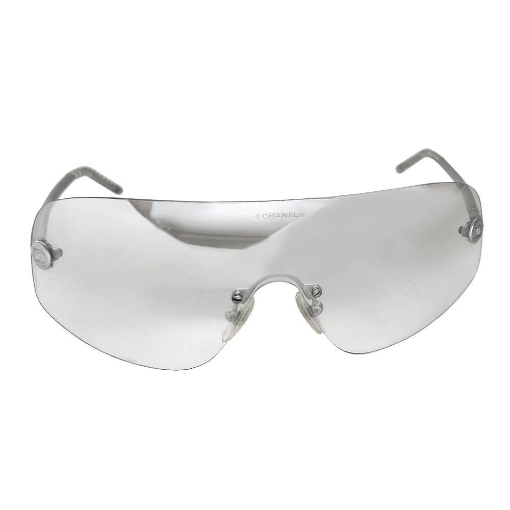 Chanel smoke to clear gradient lens shield sunglasses interlocking silver-tone CC logos at lens edges and silver-tone arms with twisted end pieces Style: 4036 Made in Italy 