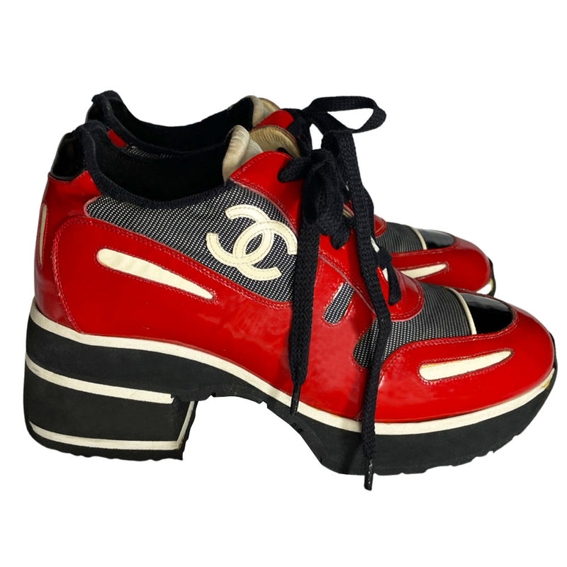 Chanel red with white patent block heel platform lace up sneakers by Karl Lagerfeld for Chanel, SS 1997 runway with nylon fabric inserts and tongue with CHANEL logo, white leather CC stitched logos on either side. Black rubber platform with white  stripe & black with white stripe stacked rubber block heel, Chanel logo treaded sole. Made in Italy 