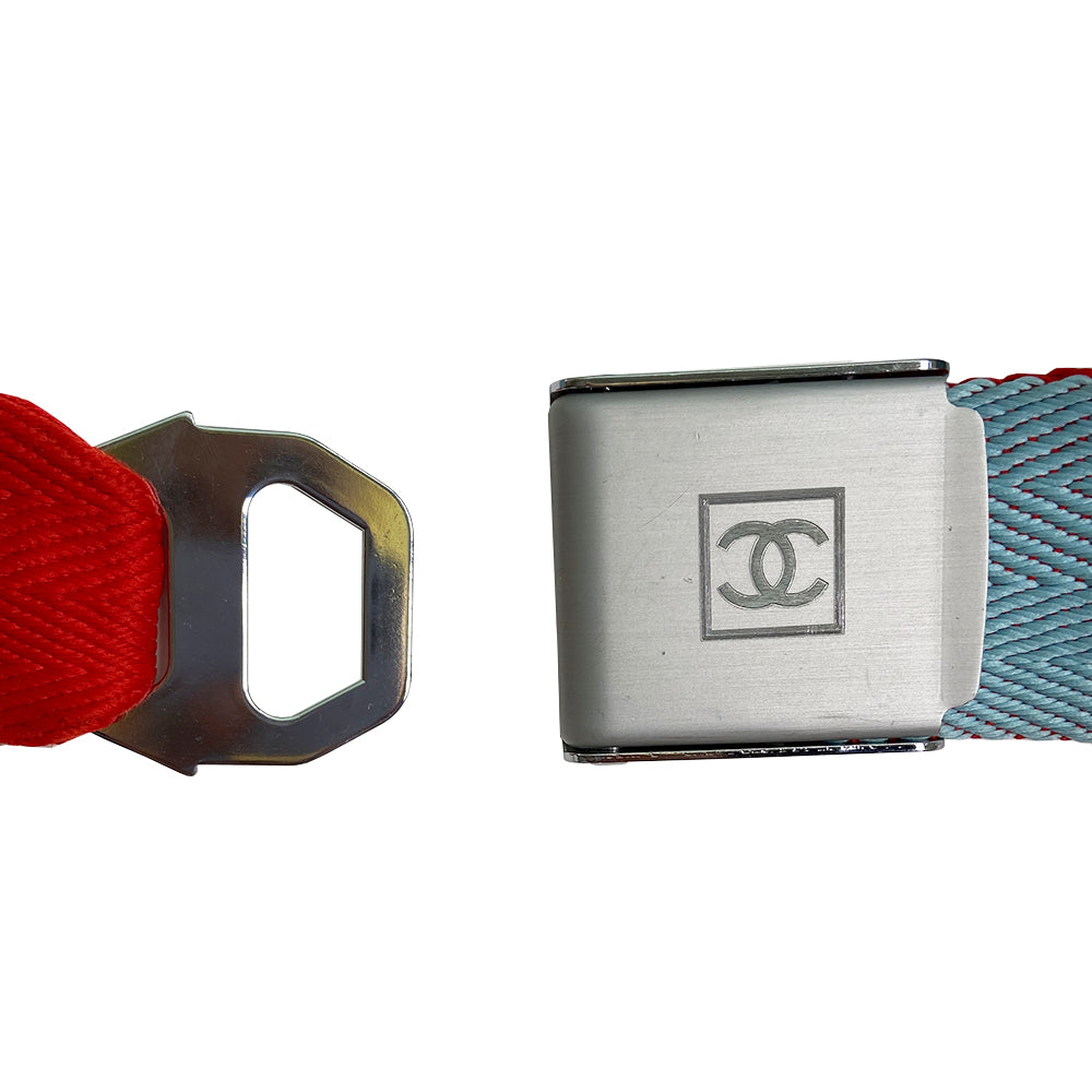 Pale Blue & Red Sport CC Logo Silver Buckle Belt from Spring/Summer 2002 Sport Line. Slight scratch on the buckle. Chevron pattern woven fabric belt that slides through brushed silver-tone interlocking CC logo clip buckle closure. Adjustable size Color: Pale blue and red. Made in France. Total L (in) 34" W (in) 2"