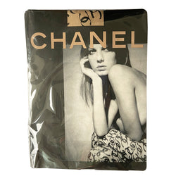 Chanel ribbon CC logo tights fall 2000 RTW runway by Karl Lagerfeld for Chanel in neutral beige color "patterned fancy tights” with all over ribbon design and black CC logos. Interlocking CC logos at waistband, cotton gusset, reinforced toes. Unused in original package. Made in France 