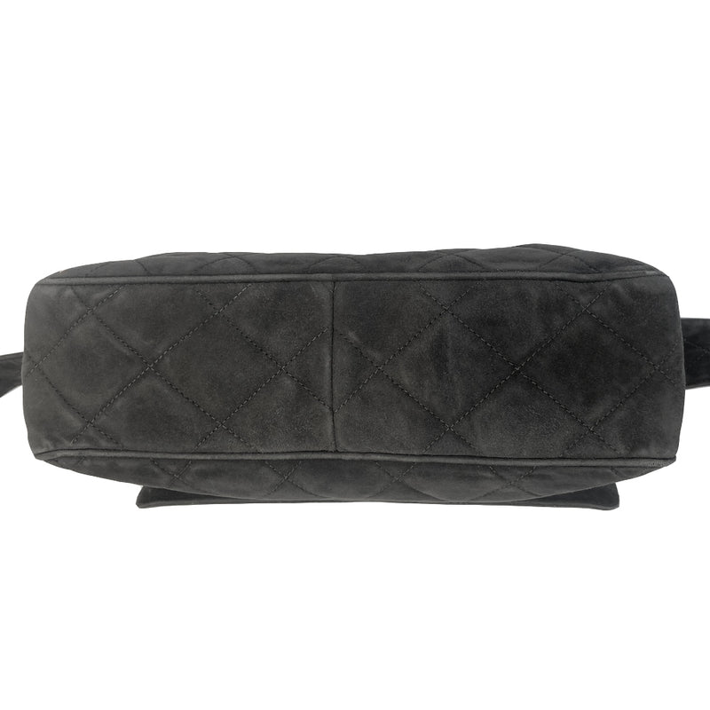 Chanel quilted CC logo crossbody charcoal grey shoulder bag with suede strap by Karl Lagerfeld for Chanel, 1995 with etched gold ball and tassels zipper pull, outer flap pocket with black leather lining, interior zippered pocket. Made in France