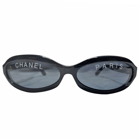 Chanel Paris logo oval acetate frame runway sunglasses by Karl Lagerfeld for Chanel, spring 1993 with gold CC logos on sides and "CHANEL PARIS" printed on lenses. Made in italy