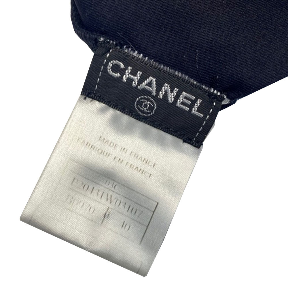 Chanel colorblock black and white belted one piece swimsuit by Karl Lagerfeld for Chanel 2003 Cruise Collection.  Double layered backless tank style bodice with removable belt with interlocking CC enamel coated metal clasp closure. Made in France 
