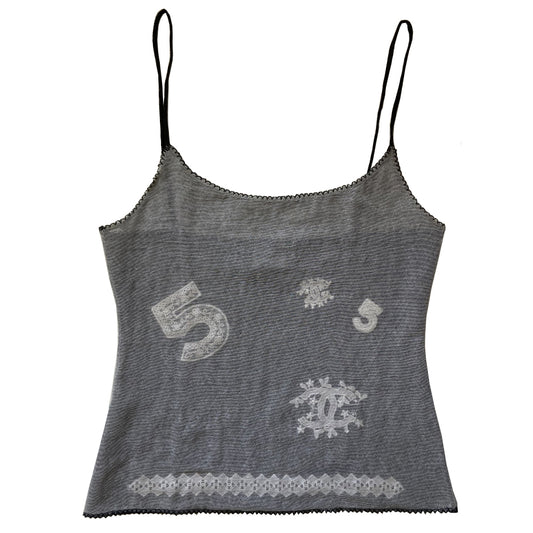 Chanel mesh embroidered tank from 2004 Spring RTW runway by Karl Lagerfeld for Chanel. Fine lined mesh fabric camisole with embroidered No 5 and interlocking CC logo embellishments scattered over the front and embroidered diamond pattern at bottom edge. Color: Black/white embroidery. Made in Italy 