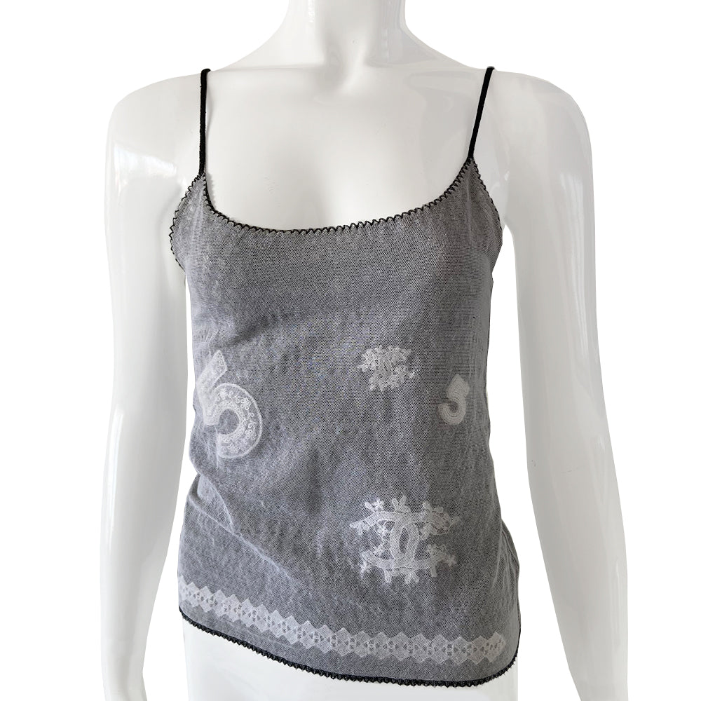 Chanel mesh embroidered tank from 2004 Spring RTW runway by Karl Lagerfeld for Chanel. Fine lined mesh fabric camisole with embroidered No 5 and interlocking CC logo embellishments scattered over the front and embroidered diamond pattern at bottom edge. Color: Black/white embroidery. Made in Italy 