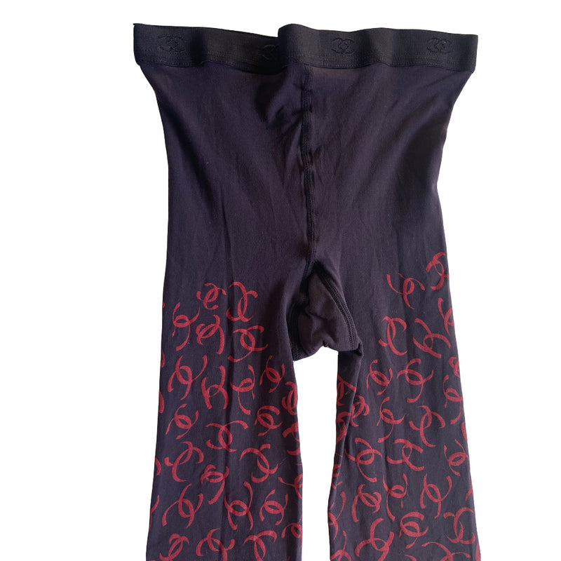 Chanel CC logo tights from Fall 2000 RTW runway collection by Karl Lagerfeld for Chanel. Blue color "patterned fancy tights” with all over ribbon design red CC logos, interlocking CC logos at waistband, cotton gusset, reinforced toes. Made in France 