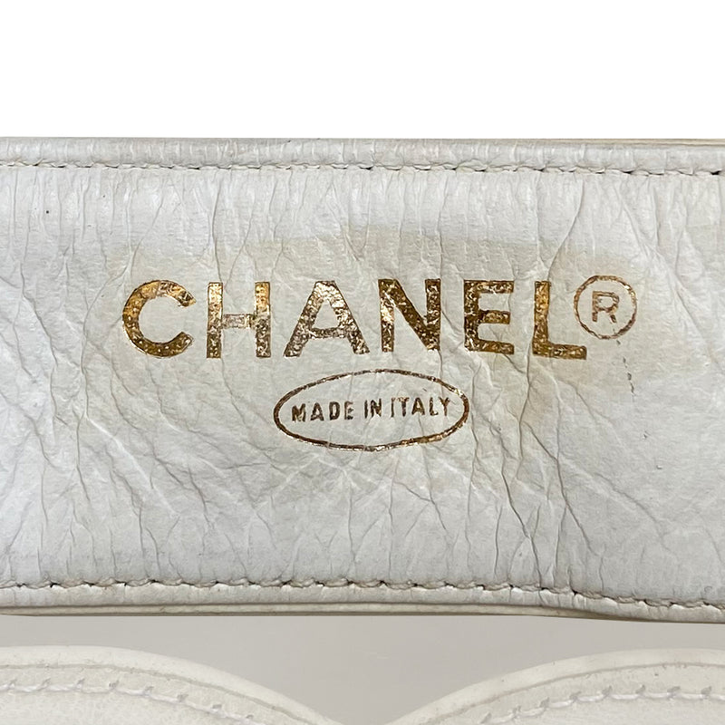 Chanel Triple CC tote by Karl Lagerfeld for Chanel, 1995. Clear vinyl with white lamb leather CC logos, outer edges, leather with gold chain shoulder straps, interior dual gold Chanel engraved magnetic snap closure. Attached leather inner zippered pouch with gold-tone CC logo zipper pull. Interior date code attached. Made in Italy 