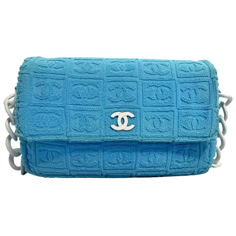 Chanel sky blue blue terry towel flap bag Karl Lagerfeld for Chanel 2002 with all over boxed cc logo embossed terry cloth flap bag with bold white acrylic chain strap, white cc front logo at flap, white zipper closure, white leather lining with one pvc pocket and 1 slip pocket. Made in Italy 