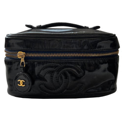 Chanel black patent leather vanity case by Karl Lagerfeld for Chanel 1996-1997 Rectangular bag with stitched interlocking CC logo at front, top handle, zip around closure with leather disc zipper pull embellished with gold CC logo. Leather interior with inner slip pocket pouch, Chanel stamped inside. Made in Italy 