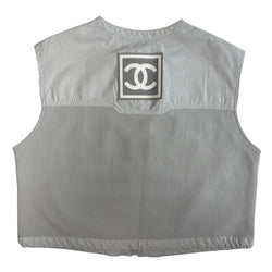 Chanel Identification logo collarless zip front grey vest/top by Karl Lagerfeld for Chanel, spring 2001 with box CC logo appliqué in back, CC logo engraved zipper pull and silver-tone toggles that adjust the elastic cording at bottom hemline. Made in Italy 