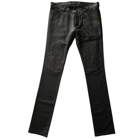 Custom-made unused black leather pants by Chrome Hearts, Los Angeles Front CH appliqué fleur du lis patch at front knees. 5 cross patches, Chrome Hearts jacquard silk lining, 5 sterling silver fly buttons. Three front pockets with sterling grommets, back pocket with sterling Chrome Hearts banner, Interior leather Chrome Hearts USA banner embossed patch. 