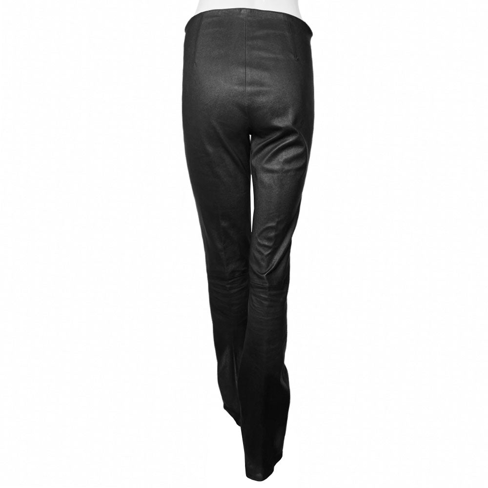 Butter soft women’s boot cut leather pants with CH appliqué signature fleur de lis at front knees. Faux front slash pockets, zip fly closure with signature dagger zipper pull and sterling cross top button. Chrome Hearts USA banner embossed leather patch at interior waist. Made in USA 