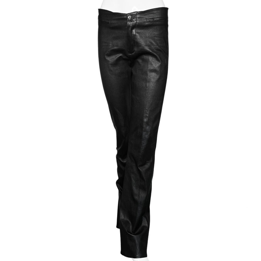 Butter soft women’s boot cut leather pants with CH appliqué signature fleur de lis at front knees. Faux front slash pockets, zip fly closure with signature dagger zipper pull and sterling cross top button. Chrome Hearts USA banner embossed leather patch at interior waist. Made in USA 
