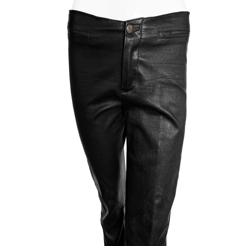 Butter soft women’s boot cut leather pants with CH appliqué signature fleur de lis at front knees. Faux front slash pockets, zip fly closure with signature dagger zipper pull and sterling cross top button. Chrome Hearts USA banner embossed leather patch at interior waist. Made in USA 