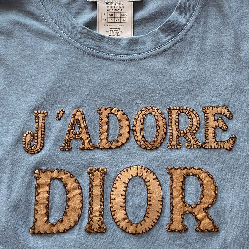 Christian Dior J'adore Dior short sleeve tee by John Galliano.  Front logo in beige suede logo with contrast brown stitching.  One stitch missing on the O as shown in photos.  FR size 44. Made in Italy