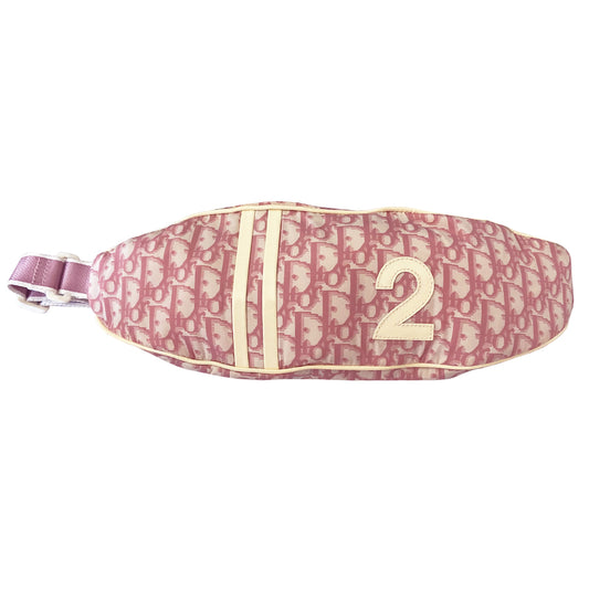 Christian Dior pink monogram canvas waist pouch John Galliano for Dior, 2004 with white patent leather appliqué No 2, dual front stripes and piping. Pink with white edge satin webbing adjustable belt with white plastic logo clip closure. Pink textile lined interior, two rear zip pocket. Made in Spain