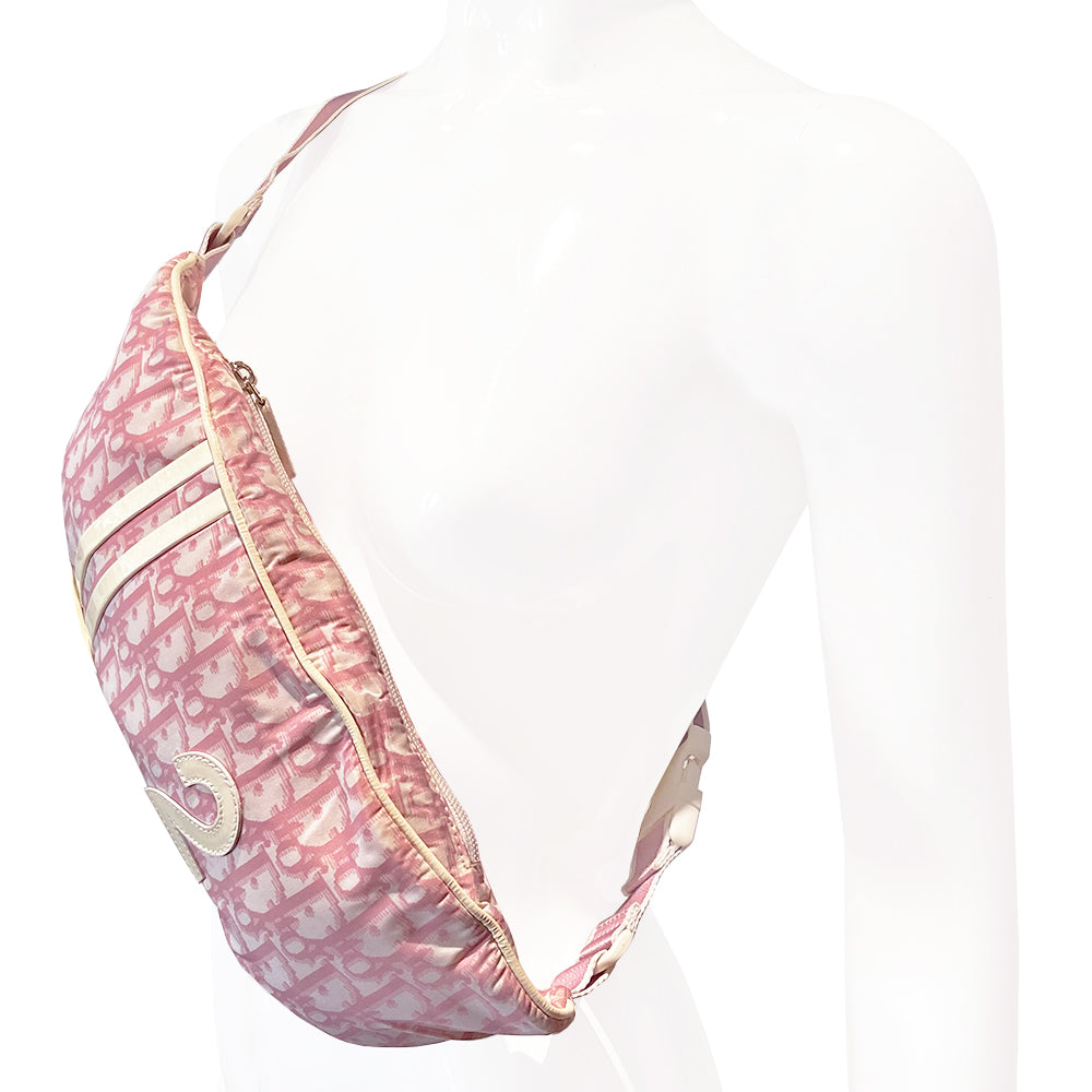 Christian Dior pink monogram canvas waist pouch John Galliano for Dior, 2004 with white patent leather appliqué No 2, dual front stripes and piping. Pink with white edge satin webbing adjustable belt with white plastic logo clip closure. Pink textile lined interior, two rear zip pocket. Made in Spain
