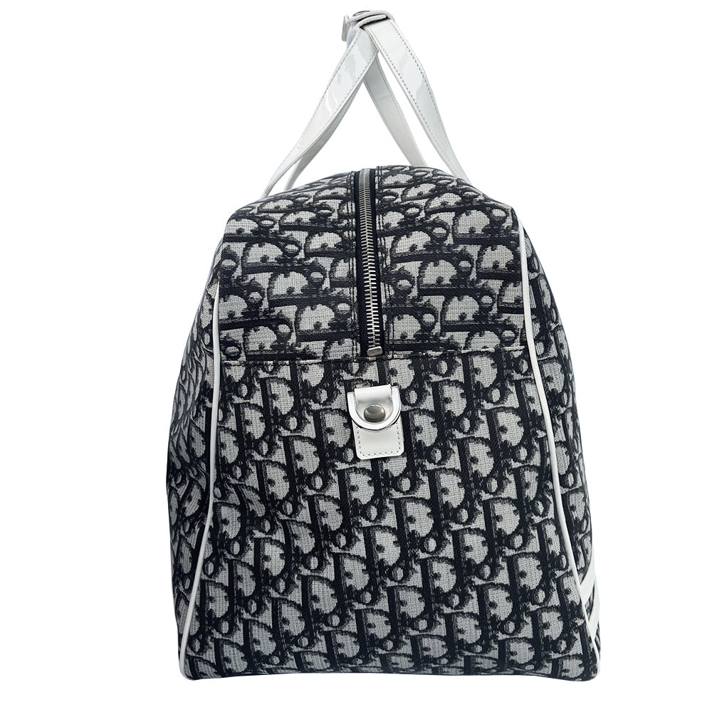 Christian Dior black monogram canvas large travel tote by John Galliano for Dior, 2001 runway. White patent leather flat handles, piping, accent No 1 with 2 accent stripes in front. Small back ID slotted window. Silver-tone zipper and hardware opens to black satin fabric lining with one zip pocket and snap closure slip pockets. Made in Italy 